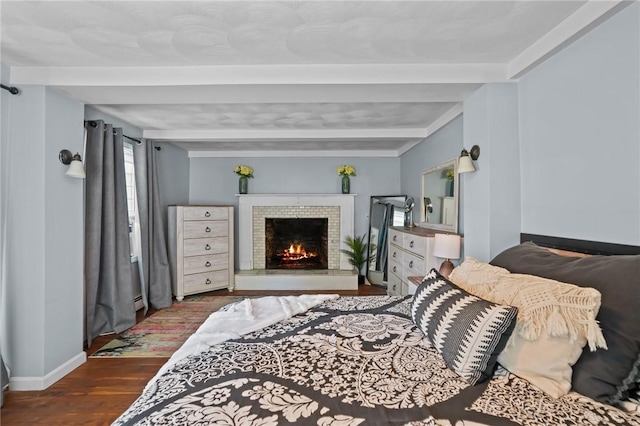 273 Main St, Cranston, RI 02823 - bedroom with beam ceiling, wood finished floors, and a brick fireplace