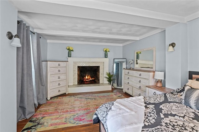 273 Main St, Cranston, RI 02823 - bedroom featuring beamed ceiling, wood finished floors, and a warm lit fireplace