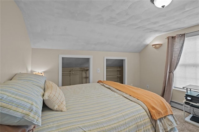 273 Main St, Cranston, RI 02823 - bedroom with lofted ceiling, carpet floors, a spacious closet, and a baseboard radiator