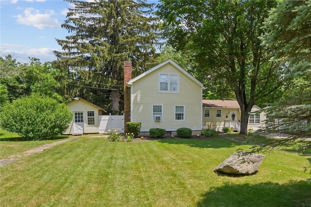 273 Main St, Cranston, RI 02823 - back of property featuring a chimney, an outbuilding, and cooling unit