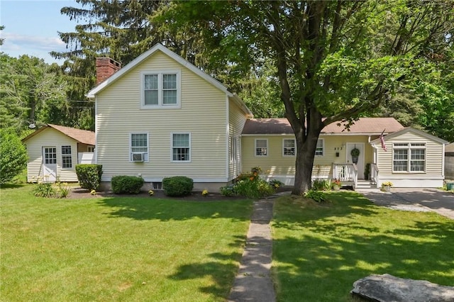 273 Main St, Cranston, RI 02823 - view of front of property with a chimney, a front yard, and cooling unit