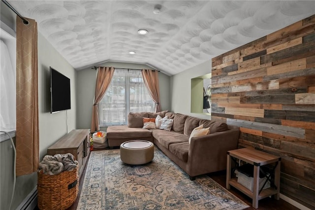 273 Main St, Cranston, RI 02823 - living room featuring vaulted ceiling, wooden walls, baseboard heating, and wood finished floors