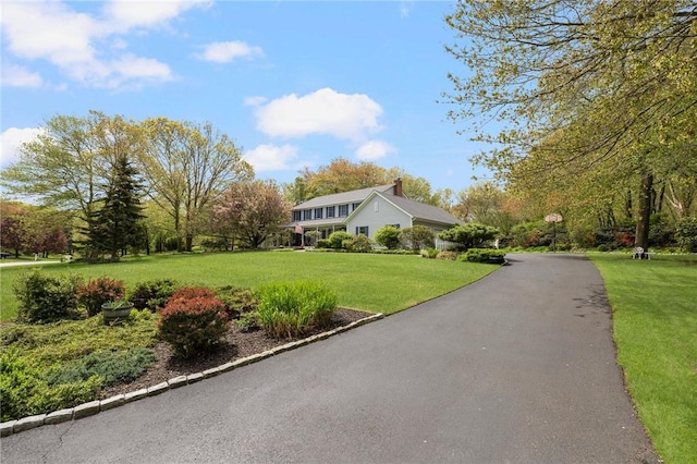 34 Finch Ln, North Kingstown, RI 02874 - view of front facade with a front lawn