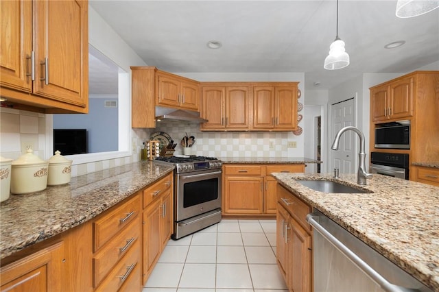 34 Finch Ln, North Kingstown, RI 02874 - kitchen with stainless steel appliances, under cabinet range hood, tasteful backsplash, and light stone countertops