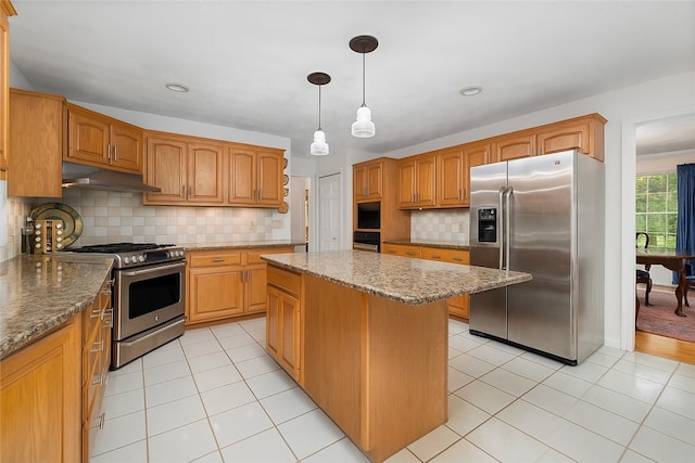 34 Finch Ln, North Kingstown, RI 02874 - kitchen featuring stainless steel appliances, under cabinet range hood, light tile patterned floors, tasteful backsplash, and recessed lighting
