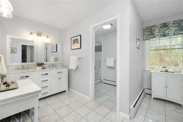 34 Finch Ln, North Kingstown, RI 02874 - full bathroom with baseboard heating, double vanity, tiled shower, and marble look tiles