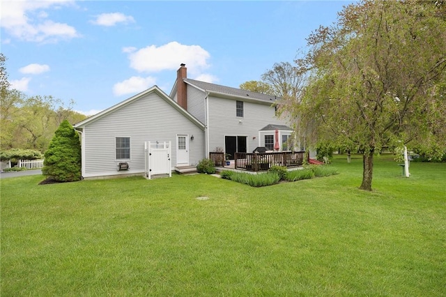 34 Finch Ln, North Kingstown, RI 02874 - rear view of property with a lawn, a chimney, and a deck