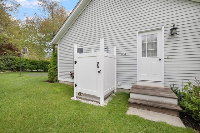 34 Finch Ln, North Kingstown, RI 02874 - view of exterior entry featuring a yard