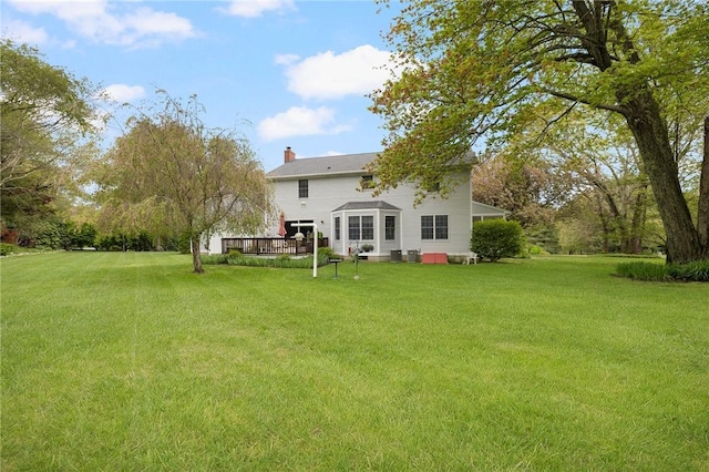 34 Finch Ln, North Kingstown, RI 02874 - rear view of property with a lawn, a deck, and a chimney