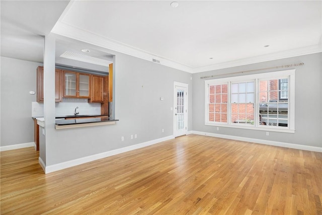 279 Benefit St Unit 3, Providence, RI 02903 - unfurnished living room with ornamental molding and light wood finished floors