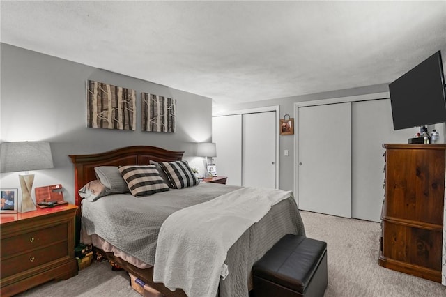 47 Pheasant Run Unit A, Smithfield, RI 02917 - bedroom with multiple closets and carpet flooring