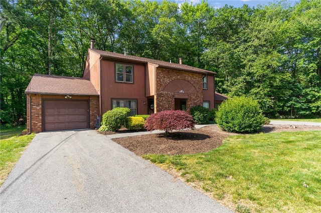 47 Pheasant Run Unit A, Smithfield, RI 02917 - view of front of property featuring a garage, asphalt driveway, brick siding, and a chimney