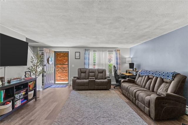 47 Pheasant Run Unit A, Smithfield, RI 02917 - living room with a textured ceiling and wood finished floors