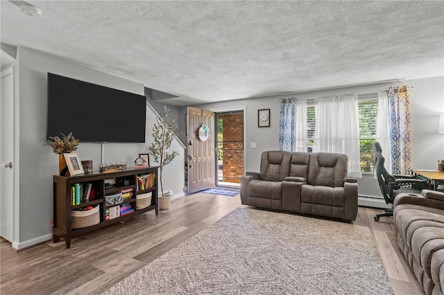 47 Pheasant Run Unit A, Smithfield, RI 02917 - living room with a textured ceiling and wood finished floors