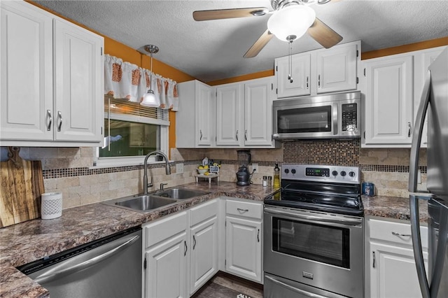 47 Pheasant Run Unit A, Smithfield, RI 02917 - kitchen featuring appliances with stainless steel finishes, white cabinets, dark countertops, and a textured ceiling