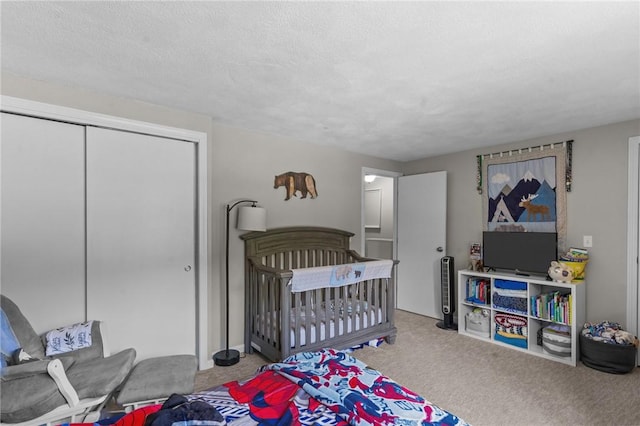 47 Pheasant Run Unit A, Smithfield, RI 02917 - bedroom featuring carpet, a closet, and a textured ceiling