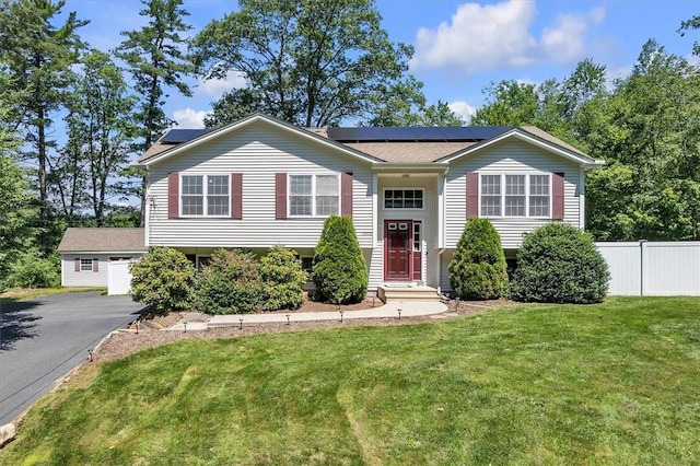 1060 Joslin Rd, Burrillville, RI 02830 - split foyer home featuring roof mounted solar panels and asphalt driveway