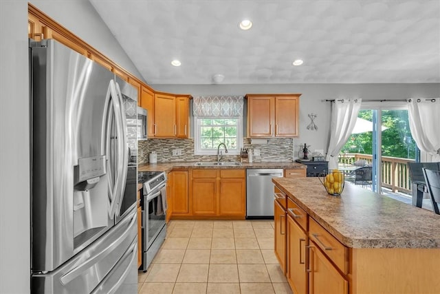 1060 Joslin Rd, Burrillville, RI 02830 - kitchen featuring appliances with stainless steel finishes, backsplash, light tile patterned flooring, a center island, and recessed lighting
