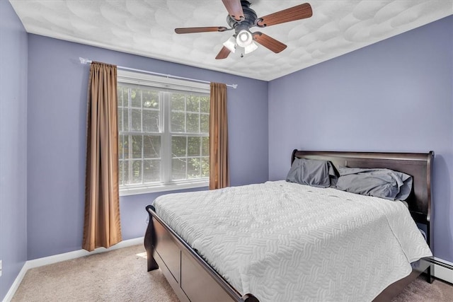 1060 Joslin Rd, Burrillville, RI 02830 - bedroom featuring light colored carpet, a baseboard heating unit, and a ceiling fan