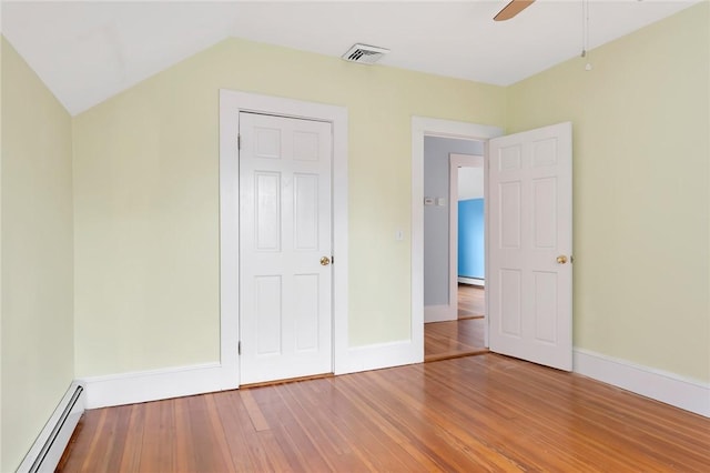 1 Slocum St, Newport, RI 02840 - unfurnished bedroom with a baseboard heating unit, wood finished floors, and a ceiling fan