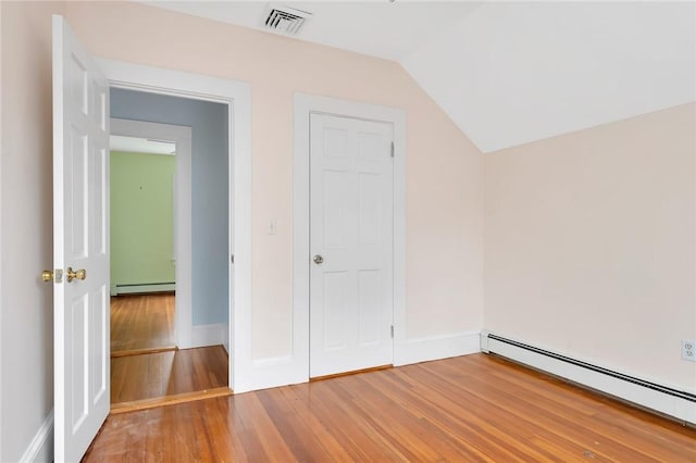 1 Slocum St, Newport, RI 02840 - additional living space featuring a baseboard heating unit, light wood-style floors, and lofted ceiling