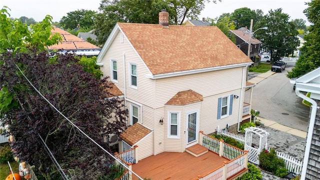 1 Slocum St, Newport, RI 02840 - back of property featuring a shingled roof, a chimney, and a deck