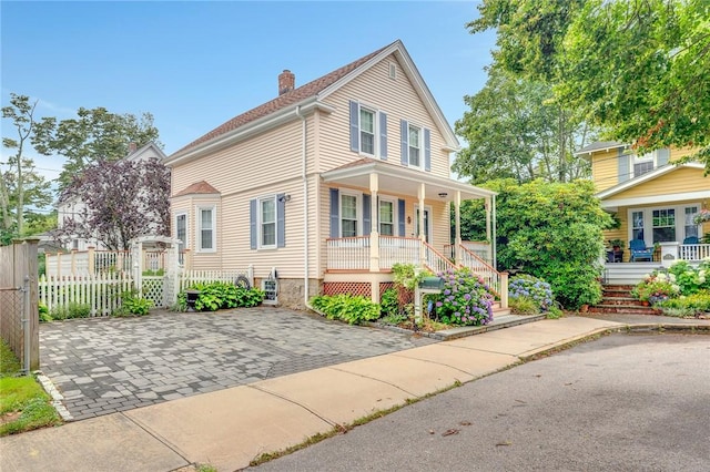 1 Slocum St, Newport, RI 02840 - view of front facade with covered porch, a chimney, and stairs