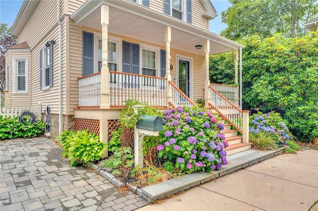 1 Slocum St, Newport, RI 02840 - view of front of house featuring covered porch and stairway