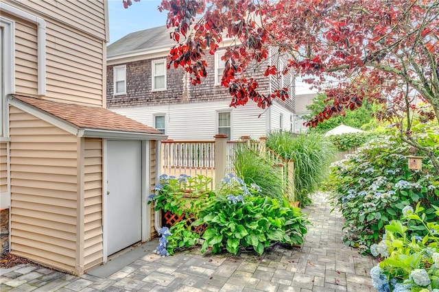 1 Slocum St, Newport, RI 02840 - back of house featuring roof with shingles and a storage unit