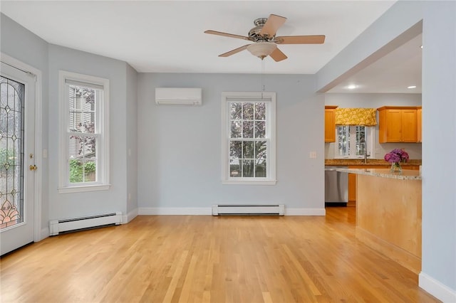 1 Slocum St, Newport, RI 02840 - unfurnished living room featuring a baseboard heating unit, a wall unit AC, light wood-style flooring, ceiling fan, and recessed lighting