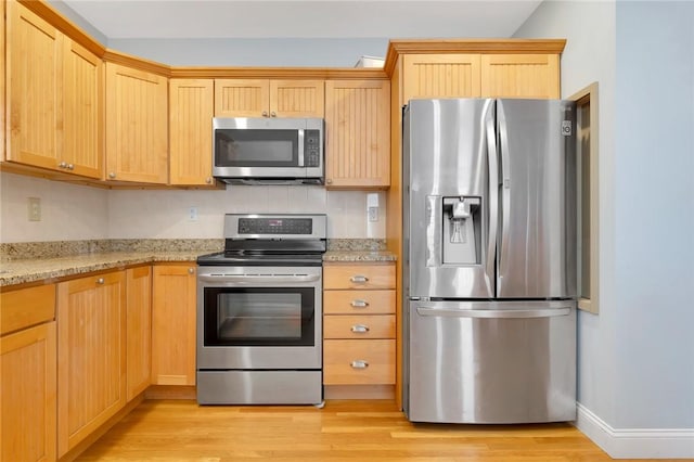 1 Slocum St, Newport, RI 02840 - kitchen featuring stainless steel appliances, light wood-style flooring, light brown cabinets, and light stone countertops