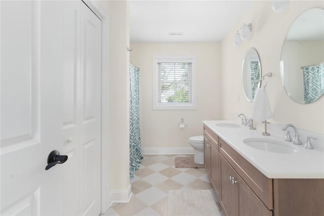 9 Scarlett Way, Cranston, RI 02921 - bathroom with double vanity, tile patterned floors, and curtained shower