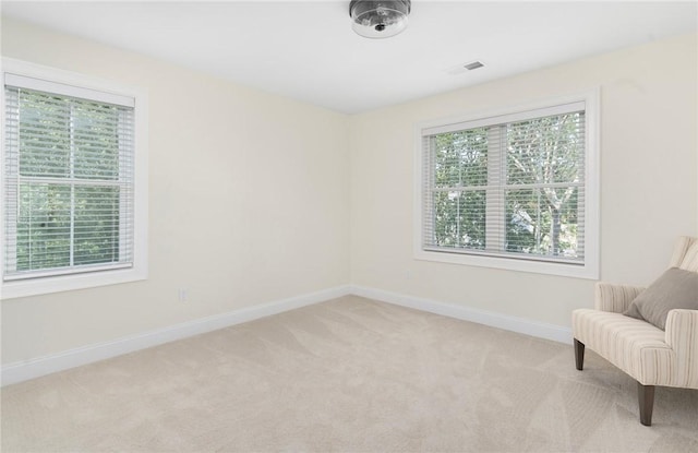9 Scarlett Way, Cranston, RI 02921 - living area with light colored carpet and baseboards