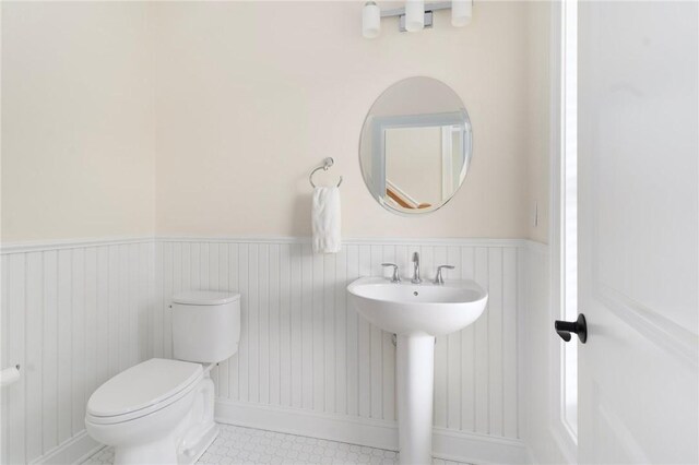 9 Scarlett Way, Cranston, RI 02921 - bathroom featuring a wainscoted wall and toilet