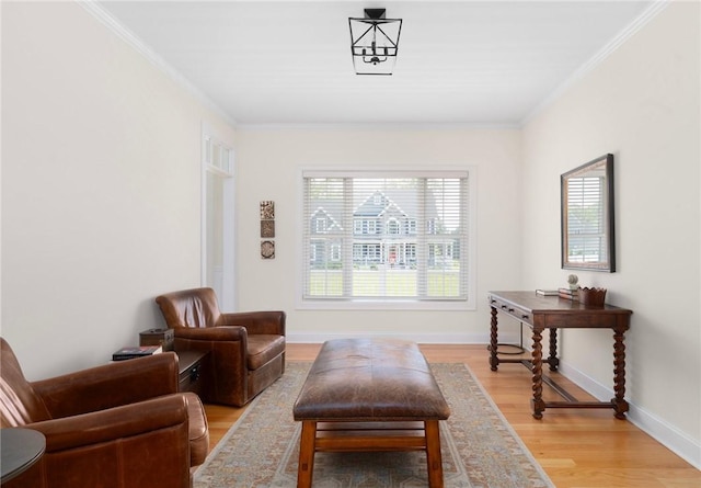9 Scarlett Way, Cranston, RI 02921 - sitting room with light wood-style floors and crown molding