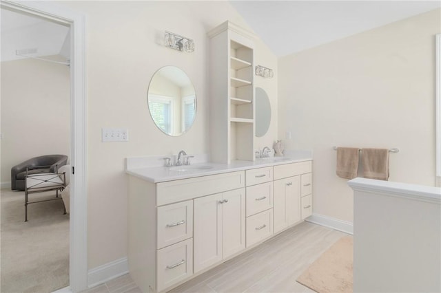 9 Scarlett Way, Cranston, RI 02921 - bathroom featuring double vanity and vaulted ceiling