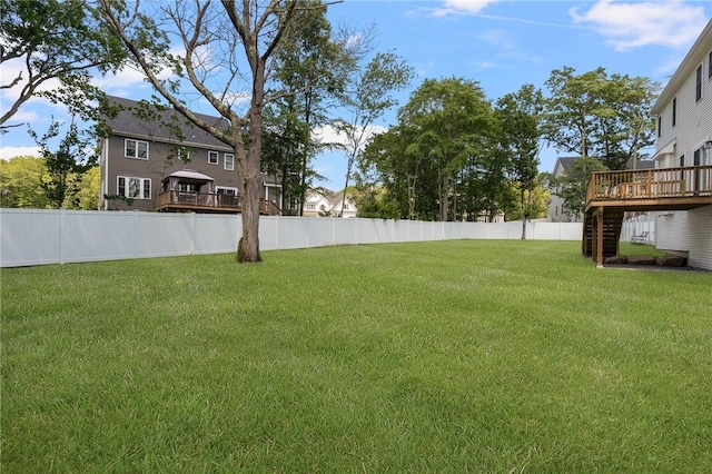 9 Scarlett Way, Cranston, RI 02921 - fenced backyard with a deck and stairway