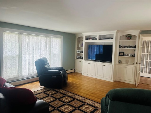 199 Love Ln, Warwick, RI 02886 - living room featuring baseboard heating and light wood-type flooring