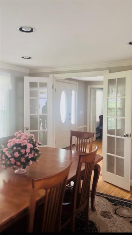 199 Love Ln, Warwick, RI 02886 - dining space featuring crown molding, french doors, and light wood-style floors