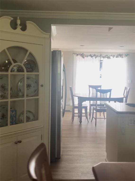 199 Love Ln, Warwick, RI 02886 - dining space with crown molding and light wood-type flooring