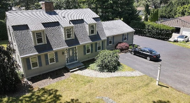 199 Love Ln, Warwick, RI 02886 - view of front of home featuring a chimney and a front lawn