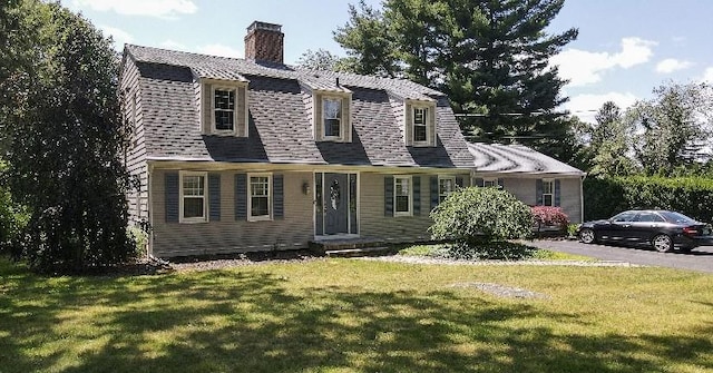 199 Love Ln, Warwick, RI 02886 - colonial inspired home featuring a chimney and a front lawn