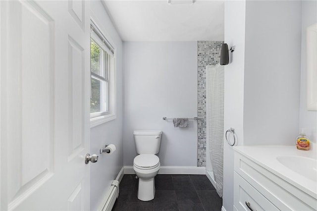 2 Palfrey Pl, Providence, RI 02909 - full bath with a baseboard heating unit, a tile shower, vanity, and tile patterned floors