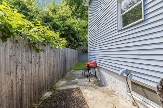 2 Palfrey Pl, Providence, RI 02909 - fenced backyard with area for grilling and a patio