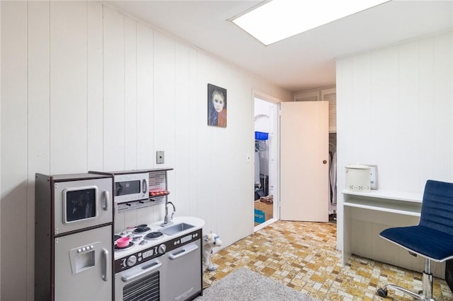 598 Laurel Hill Ave, Cranston, RI 02920 - kitchen with white microwave and light floors