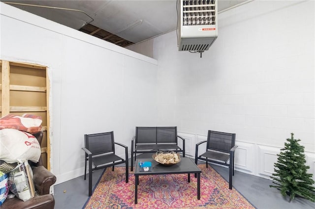 598 Laurel Hill Ave, Cranston, RI 02920 - living area featuring concrete flooring and a heating unit