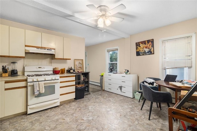 598 Laurel Hill Ave, Cranston, RI 02920 - kitchen featuring white gas range oven, under cabinet range hood, cream cabinetry, light countertops, and ceiling fan