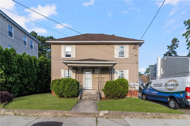 598 Laurel Hill Ave, Cranston, RI 02920 - traditional style home featuring a front lawn