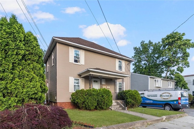 598 Laurel Hill Ave, Cranston, RI 02920 - american foursquare style home featuring a front yard