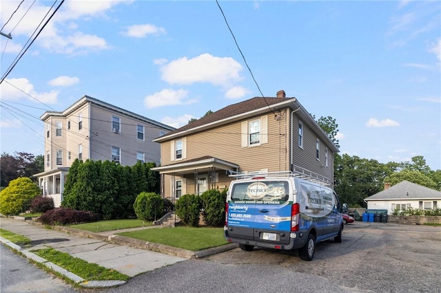 598 Laurel Hill Ave, Cranston, RI 02920 - traditional style home with a chimney and a front yard